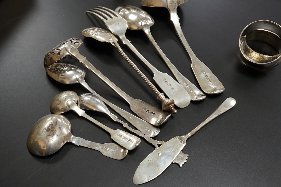 A quantity of assorted mainly 19th century flatware, various patterns, dates and makers including a set of six George III fiddle pattern table spoons by Eley, Fearn & Chawner, London, 1809, six silver fiddle pattern tabl
